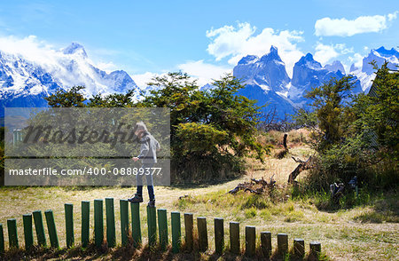 little boy having fun in torres del paine national park, patagonia, chile, active travel concept