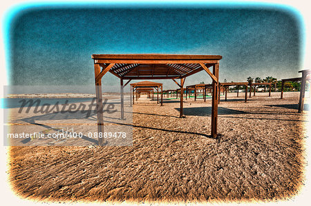 Sunshade on the Beach of Mediterranean Sea in Israel. Vintage Style Toned Picture