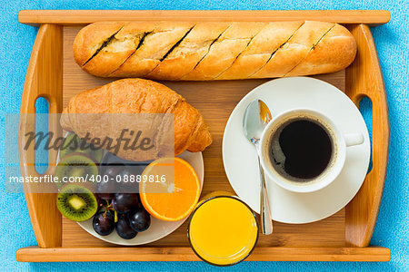 Continental breakfast on a tray from above a close-up shot