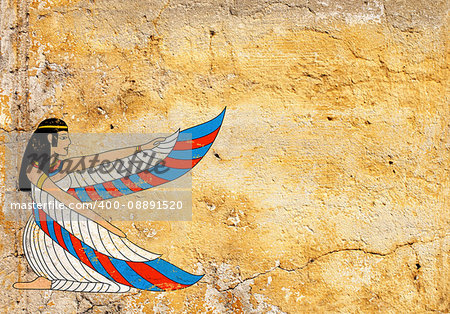 Grunge background with old stucco texture of yellow color and Egyptian goddess Isis image