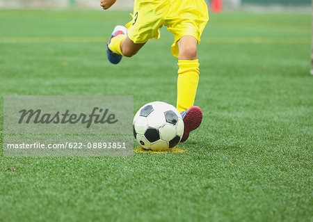 Japanese kid playing soccer