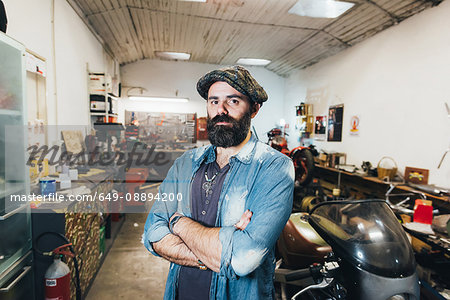 Portrait of mature man, in garage