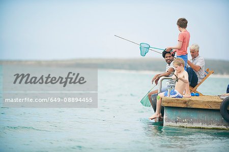 Family fishing on houseboat deck, Kraalbaai, South Africa
