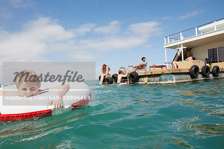 Family having fun on houseboat sun deck, Kraalbaai, South Africa