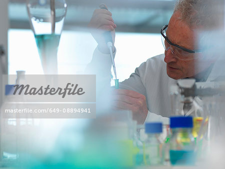 Life Science, Scientist pipetting a sample in a eppendorf vial during an experiment in the laboratory