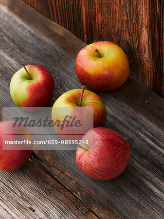 Fresh apples on a wooden table