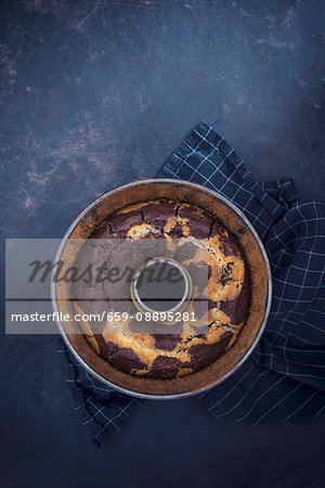 Vegan marble cake in a ring-shaped baking tin