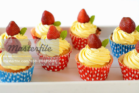 Cupcake with buttercream and strawberries