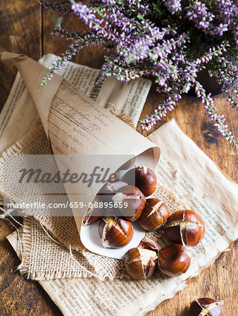Roasted chestnuts on a rustic background