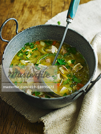 Chicken soup in a stock pot