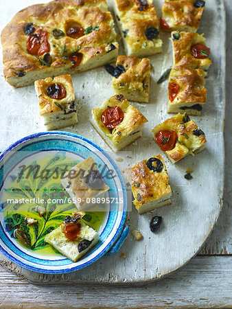 Focaccia with preserved tomatoes,olives and thyme
