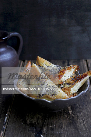 Puff pastries filled with cheese and poppy seed