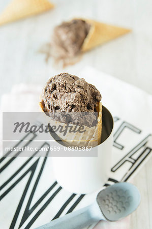 Chocolate brownie ice cream in a cone