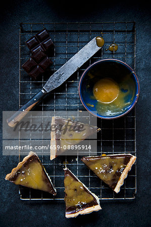Four slices of chocolate and salted carmel tart (seen from above)