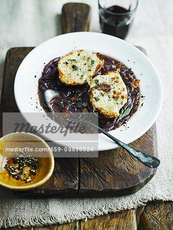 Rich red onion soup with grilled cheese on toast