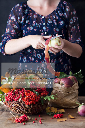 woman peeling apple