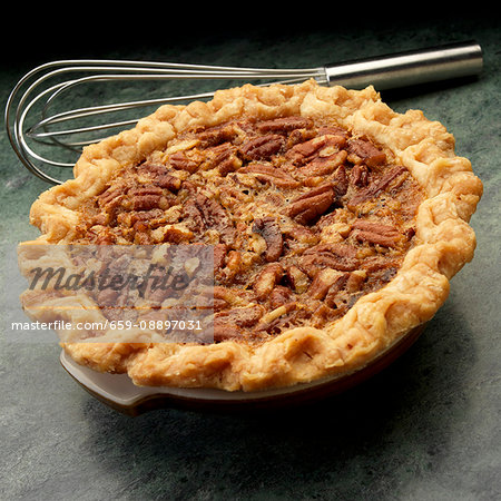Sall pecan pie with whisk