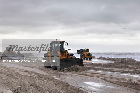 France, Northern France, Le Touquet, tractors fighting against the tide to prepare the circuit of Enduropale 2015