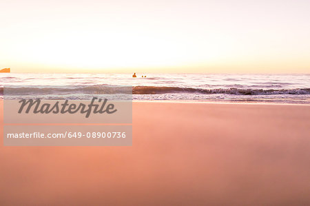 Surface level view of beach and sea at sunset, Nosara, Guanacaste Province, Costa Rica