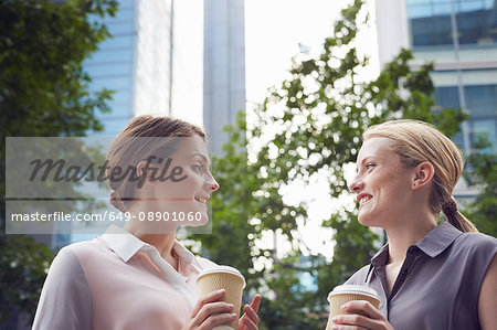 Business women having coffee break, London, UK