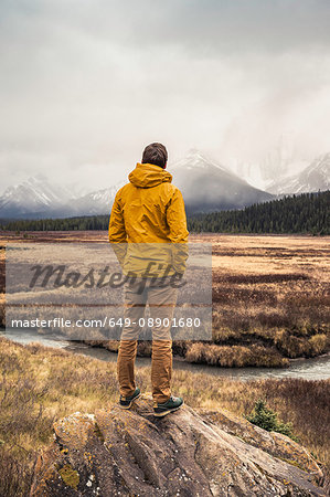 Man standing, looking at view, rear view, Kananaskis Country, Bow Valley Provincial Park, Kananaskis, Alberta, Canada