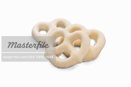 Three mini white chocolate pretzels (close-up)