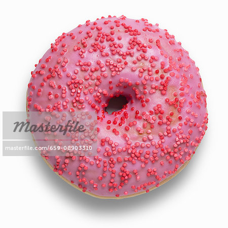 A pink doughnut decorated with red sugar sprinkles