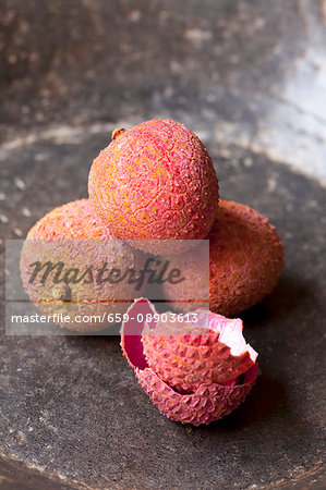 Lychees in a grey stone bowl