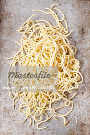 Fresh, uncooked spaghetti