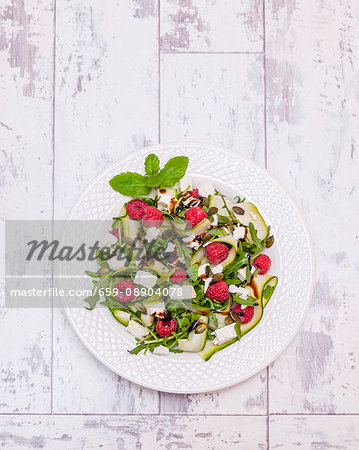 Courgette and feta cheese salad with raspberries (seen from above)