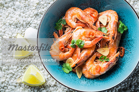 Prawns with garlic, parsley, chilli peppers and lemons