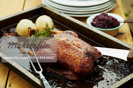 Roasted wild goose with red cabbage and dumplings