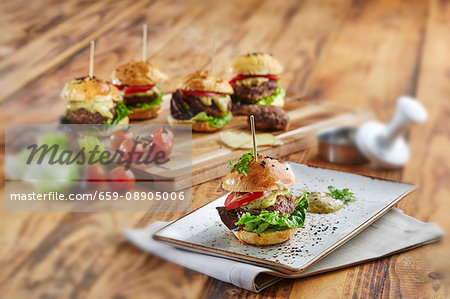 Mini hamburgers with lettuce, tomatoes and cheese