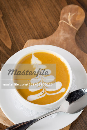 Butternut squash soup on a chopping board