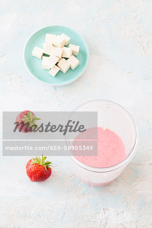 Vegan strawberry smoothie with soya milk and silk tofu