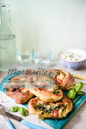 Pizza rolls with spinach, tomato and mozzerella