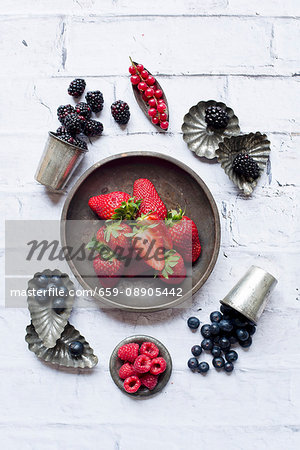 A berry arrangement with baking tins