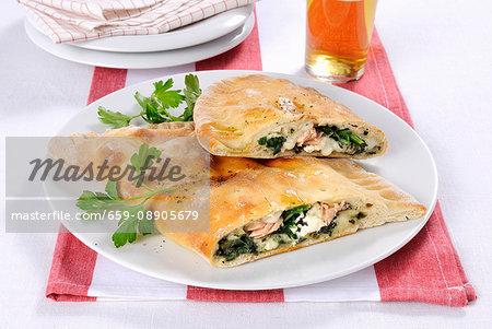 Mezzaluna con spinaci (Italian pastry pockets with a spinach filling)