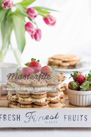 A waffle cake with advocaat cream and strawberries