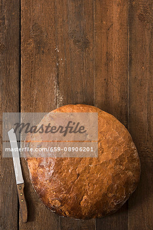 A large round loaf of wheat & rye bread