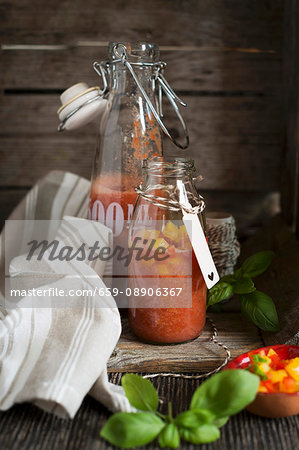 Gazpacho with tomato and peppers in swing-top bottles