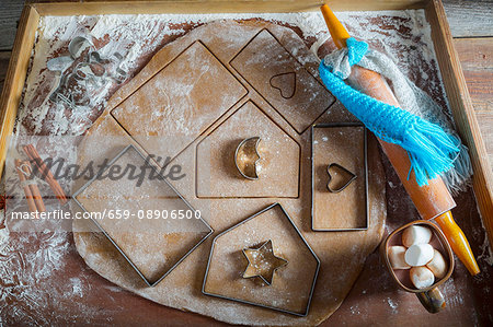 Parts for a gingerbread house being cut out