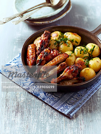 Honey-glazed chicken with oven-baked potatoes