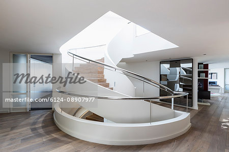 Modern spiral staircase in home showcase interior