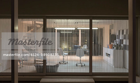 Illuminated modern home showcase interior home office at night