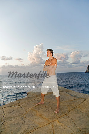 Portrait of a man in a cliff by the sea