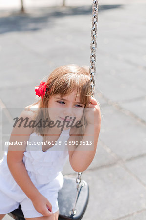 Cute girl in park on swing