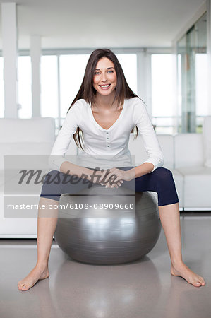 Woman with an excercise ball at home