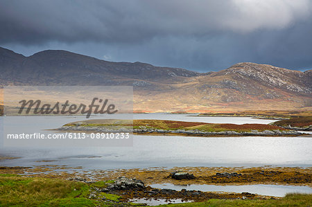 Clouds over craggy hills and lake, Loch Aineort, South Uist, Outer Hebrides