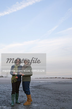Mature women standing on a beach